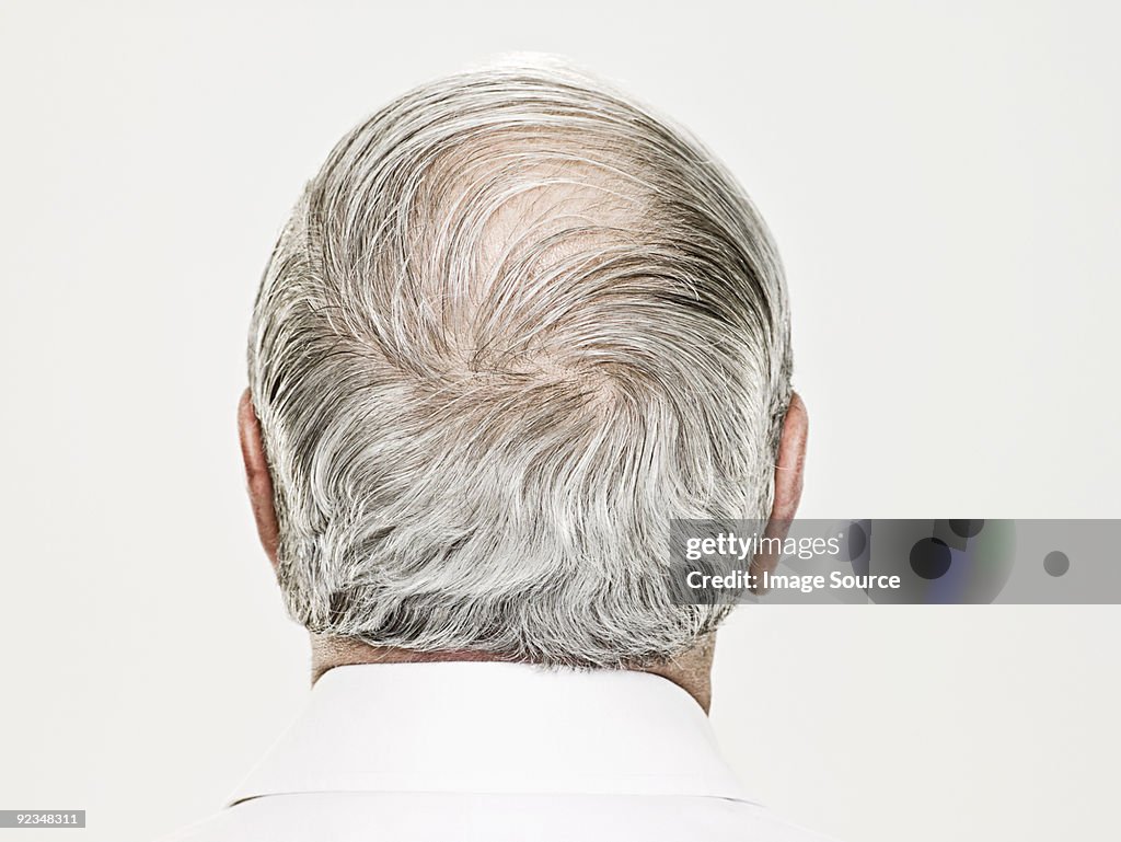 Rear view of a balding senior man