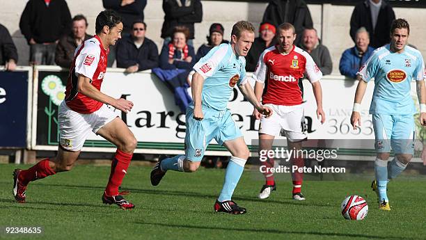 John Curtis of Northampton Town reaches the ball ahead of Stewart Drummond of Morecambe during the Coca Cola League Two match between Morecambe and...