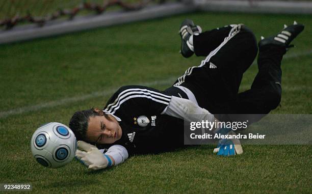 Goalkeeper Nadine Angerer of the women's German national football team saves a ball during a training session on October 26, 2009 in Gersthofen,...