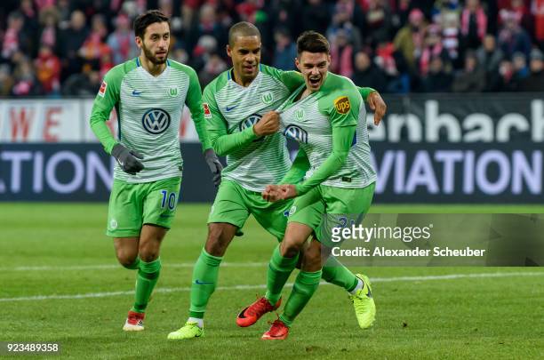 Josip Brekalo of Wolfsburg celebrates the first goal for his team with Yunus Malli of Wolfsburg and Daniel Didavi of Wolfsburg during the Bundesliga...