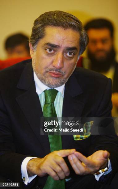 Abdullah Abdullah, former Afghan foreign minister who challenged President Hamid Karzai in last August's vote, arrives to attend a meeting with his...