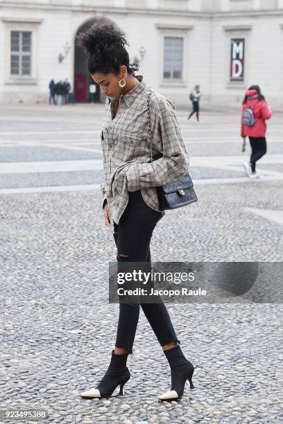 Model arrives at the Versace show during Milan Fashion Week Fall/Winter 2018/19 on February 23, 2018 in Milan, Italy.