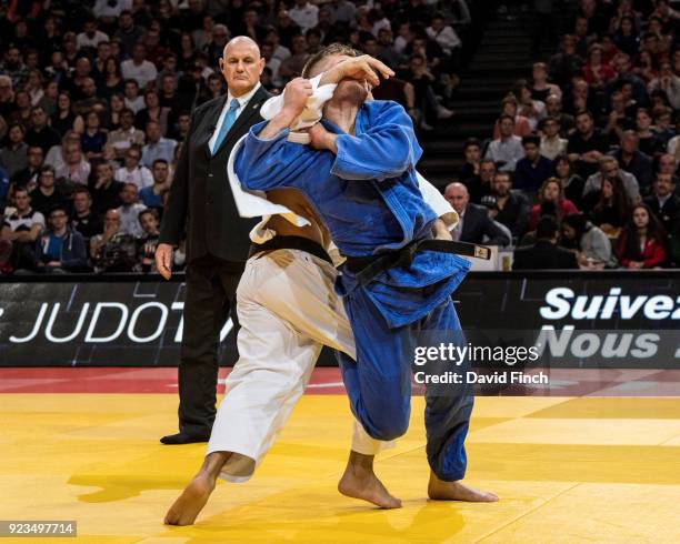 Akil Gjakova of Kosovo attacks London Olympic champion, Lasha Shavdatuashvili of Georgia throwing him for a wazari to win the u73kg gold medal during...