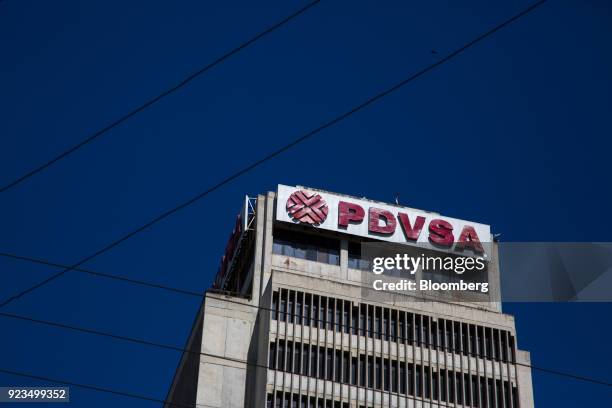 Petroleos de Venezuela SA signage is displayed on a building in Puerto La Cruz, Anzoategui State, Venezuela, on Wednesday, Feb. 7, 2018. Hunger is...