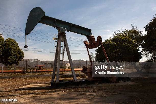 An oil pump jack stands in Puerto La Cruz, Anzoategui State, Venezuela, on Wednesday, Feb. 7, 2018. Hunger is hastening the ruin of Venezuelan's oil...