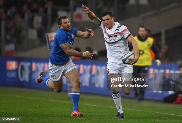 Remy Grosso of France gets past Tommaso Benvenuti of Italy during the NatWest Six Nations match between France and Italy at Stade Velodrome on...