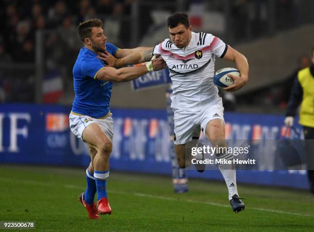 Remy Grosso of France gets past Tommaso Benvenuti of Italy during the NatWest Six Nations match between France and Italy at Stade Velodrome on...