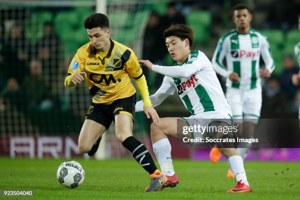 Manu Garcia Alonso of NAC Breda, Ritsu Doan of FC Groningen during the Dutch Eredivisie match between FC Groningen v NAC Breda at the NoordLease...