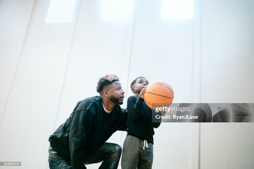 Supportive Father Plays Basketball with Son