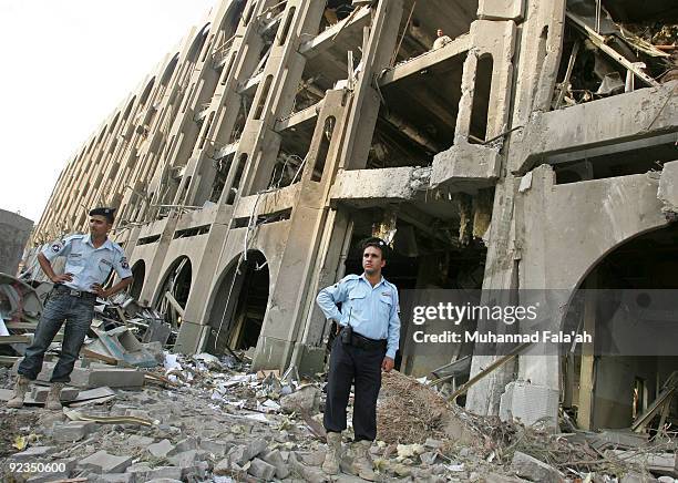 Iraqi police stand at the site of yesterday's car bomb explosion, the Ministry of Justice on October 26, 2009 in Baghdad, Iraq. Two car bombs...