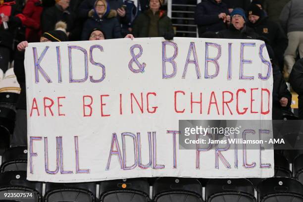 Hull City fans protest against owners Assem and Ehab Allam with a banner saying Kids and babies are being charged full adult price during the Sky Bet...