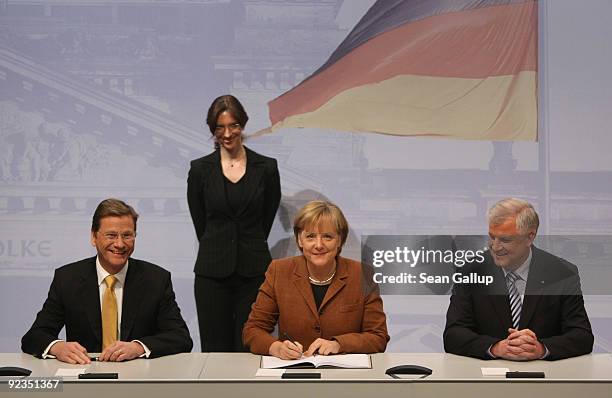 Chairman of the German Free Democrats Guido Westerwelle, German Chancellor and Chairwoman of the German Christian Democrats Angela Merkel and...