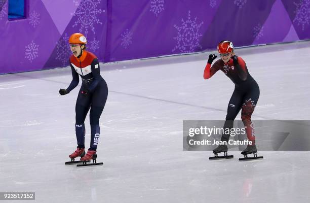 Suzanne Schulting of the Netherlands competes and wins before Kim Boutin of Canada during the Short Track Speed Skating Women's 1000m Final A on day...