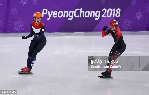 Suzanne Schulting of the Netherlands competes and wins before Kim Boutin of Canada during the Short Track Speed Skating Women's 1000m Final A on day...