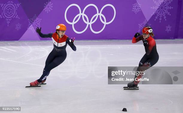 Suzanne Schulting of the Netherlands competes and wins before Kim Boutin of Canada during the Short Track Speed Skating Women's 1000m Final A on day...