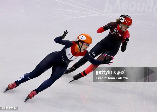 Suzanne Schulting of the Netherlands competes and wins before Kim Boutin of Canada during the Short Track Speed Skating Women's 1000m Final A on day...