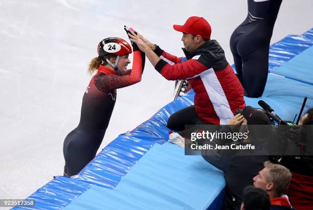 Kim Boutin of Canada celebrates her second placewith her coach following the Short Track Speed Skating Women's 1000m Final A on day thirteen of the...