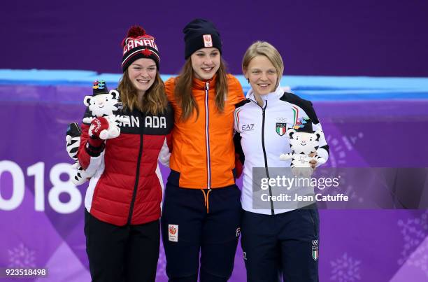 Silver medalist Kim Boutin of Canada, Gold medalist Suzanne Schulting of the Netherlands and Bronze medalist Arianna Fontana of Italy celebrate...