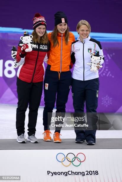 Silver medalist Kim Boutin of Canada, Gold medalist Suzanne Schulting of the Netherlands and Bronze medalist Arianna Fontana of Italy celebrate...