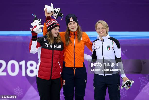 Silver medalist Kim Boutin of Canada, Gold medalist Suzanne Schulting of the Netherlands and Bronze medalist Arianna Fontana of Italy celebrate...