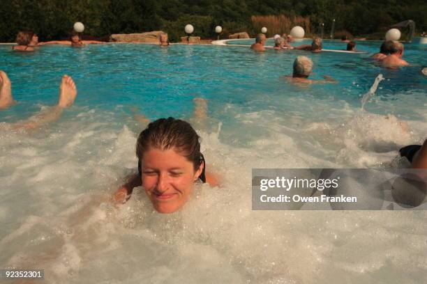 beautiful woman in a thermal pool - thermal pool stock pictures, royalty-free photos & images