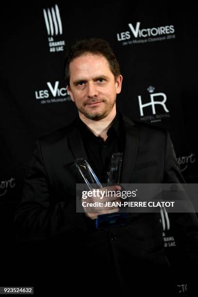 French composer Karol Beffa poses after receiving an award at the "Victoire de la musique classique" award ceremony at The Grange au Lac Auditorium...