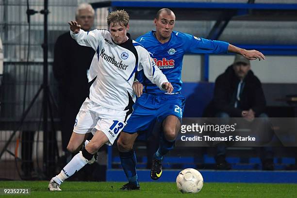 Oliver Kirch of Bielefeld and Daniel Brueckner of Paderborn tackle for the ball during the Second Bundesliga match between SC Paderborn and Arminia...