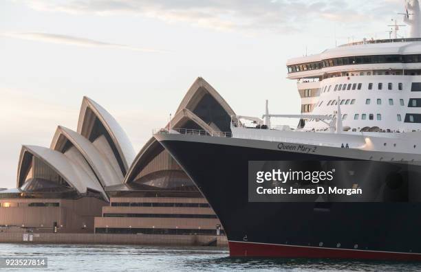 General view of the Cunard ocean liner Queen Mary 2 with the Opera House on arrival into Sydney Harbour on her world cruise from Southampton, England...