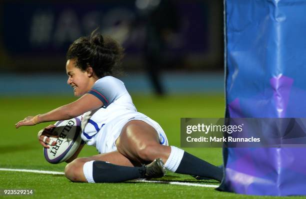 Lagi Tuima of England avoids a tackle by Louise McMillan of Scotland to score a try in the second half during the Natwest Women's Six Nations match...