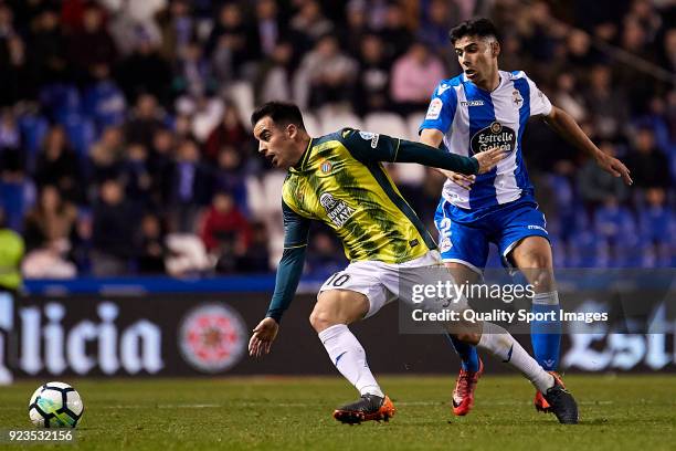 Jose Manuel Jurado of RCD Espanyol is challenged by Juanfran Moreno of Deportivo de La Coruna during the La Liga match between Deportivo La Coruna...