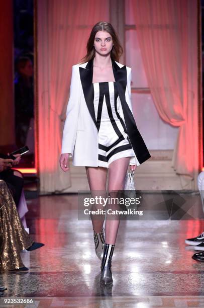 Model walks the runway at the Genny Autumn Winter 2018 fashion show during Milan Fashion Week on February 22, 2018 in Milan, Italy.