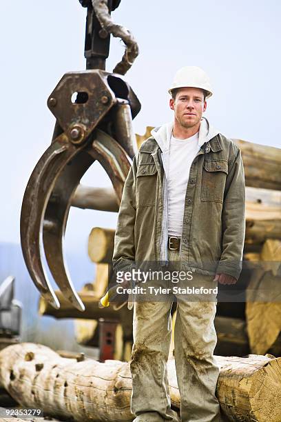 logger standing in front of mechanical claw. - carbondale colorado bildbanksfoton och bilder