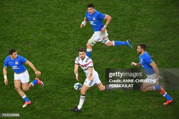 France's fullback Hugo Bonneval passes the ball during the Six Nations international rugby union match between France and Italy at the Velodrome...