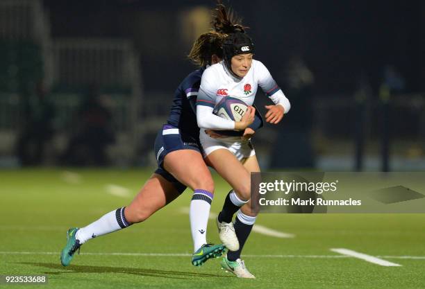 Kelly Smith of England is tackled by Lisa Thomson of Scotland during the Natwest Women's Six Nations match between Scotland Women and England Women...