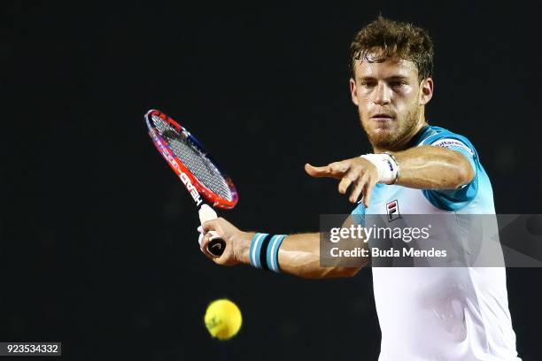 Diego Schwartzman of Argentina returns a shot to Gael Monfils of France during the quarter finals of the ATP Rio Open 2018 at Jockey Club Brasileiro...