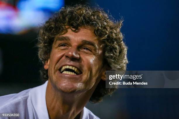 Former tennis player Gustavo Kuerten of Brazil smiles during the quarter finals of the ATP Rio Open 2018 at Jockey Club Brasileiro on February 23,...