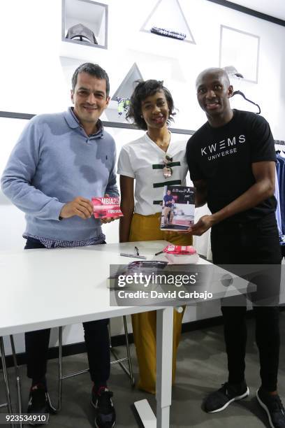 Stephane Mbia signs autographs at the Kwems clothing store with writer Roberto Arrocha on February 23, 2018 in Seville, Spain.