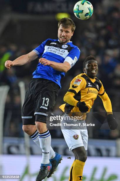 Julian Boerner of Bielefeld and Moussa Kone of Dresden head for the ball during the Second Bundesliga match between DSC Arminia Bielefeld and SG...