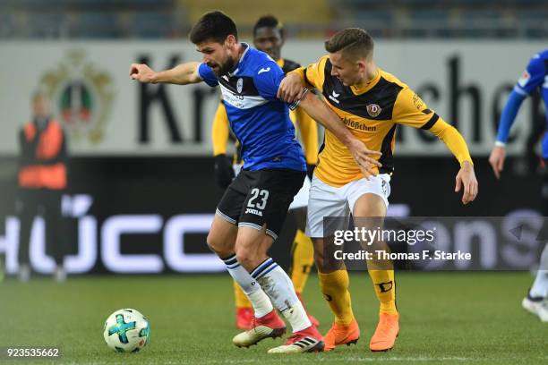 Paul Seguin of Dresden tackles Florian Dick of Bielefeld during the Second Bundesliga match between DSC Arminia Bielefeld and SG Dynamo Dresden at...