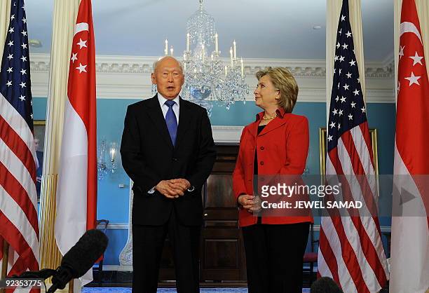 Secretary of State Hillary Clinton smiles as Minister Mentor Lee Kuan Yew of Singapore speaks during a press briefing before their meeting at the...