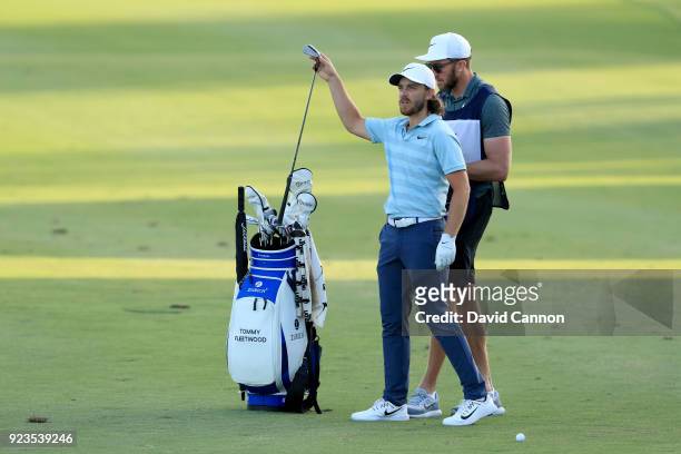 Tommy Fleetwood of England chooses his club for his third shot on the par 5, 18th hole during the second round of the 2018 Honda Classic on The...