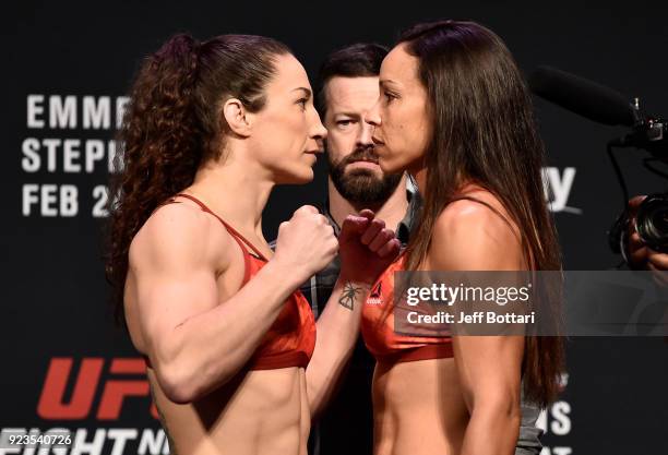 Opponents Sara McMann and Marion Reneau face off during the UFC Fight Night Weigh-in at Amway Center on February 23, 2018 in Orlando, Florida.