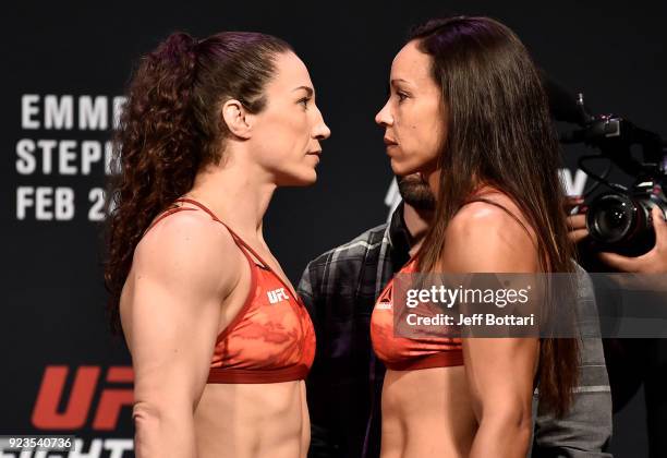 Opponents Sara McMann and Marion Reneau face off during the UFC Fight Night Weigh-in at Amway Center on February 23, 2018 in Orlando, Florida.