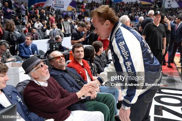 Lou Adler shakes hands with Arnold Schwarzenegger during the NBA All-Star Game as a part of 2018 NBA All-Star Weekend at STAPLES Center on February...