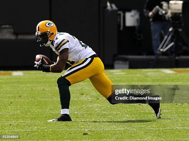 Defensive back Charles Woodson of the Green Bay Packers intercepts a pass during a game on October 25, 2009 against the Cleveland Browns at Cleveland...