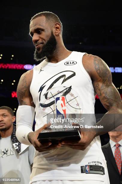 LeBron James stands with his MVP trophy after the NBA All-Star Game as a part of 2018 NBA All-Star Weekend at STAPLES Center on February 18, 2018 in...
