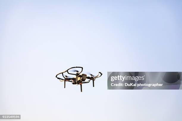 drones fly in cities. - remote controlled fotografías e imágenes de stock