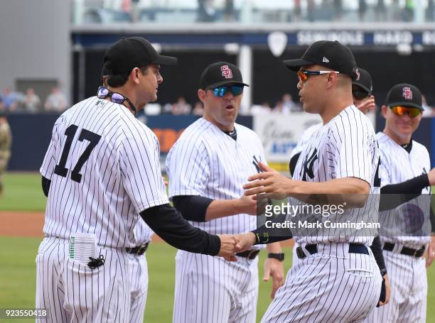 Manager Aaron Boone and Giancarlo Stanton of the New York Yankees shake hands during player introductions prior to the Spring Training game against...
