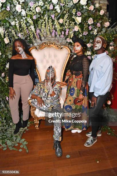 Artist Laolu Senbanjo poses with models painted with his work as Instagram celebrates #BlackGirlMagic and #BlackCreatives on February 23, 2018 in New...