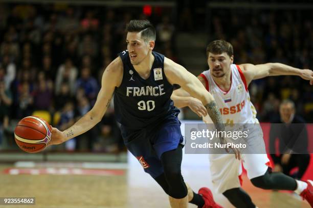 Paul Lacombe of France fights for the ball with Evgenii Baburin 4 of Russia during FIBA Basketball World Cup 2019 qualifier match between France and...